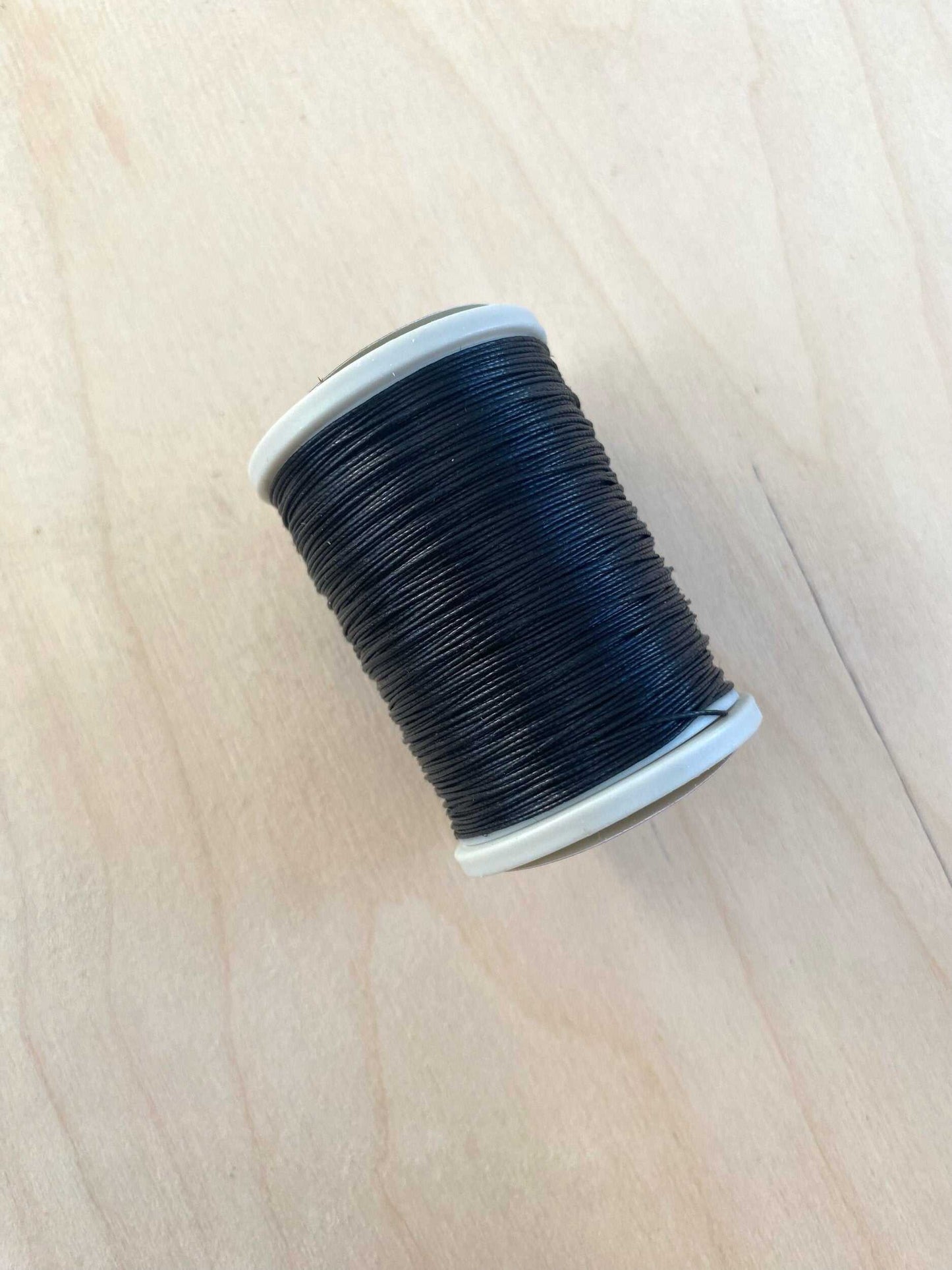 Black Cotton Linen Thread spool, 0.55 mm, 91.4 meters, for leathercraft stitching.