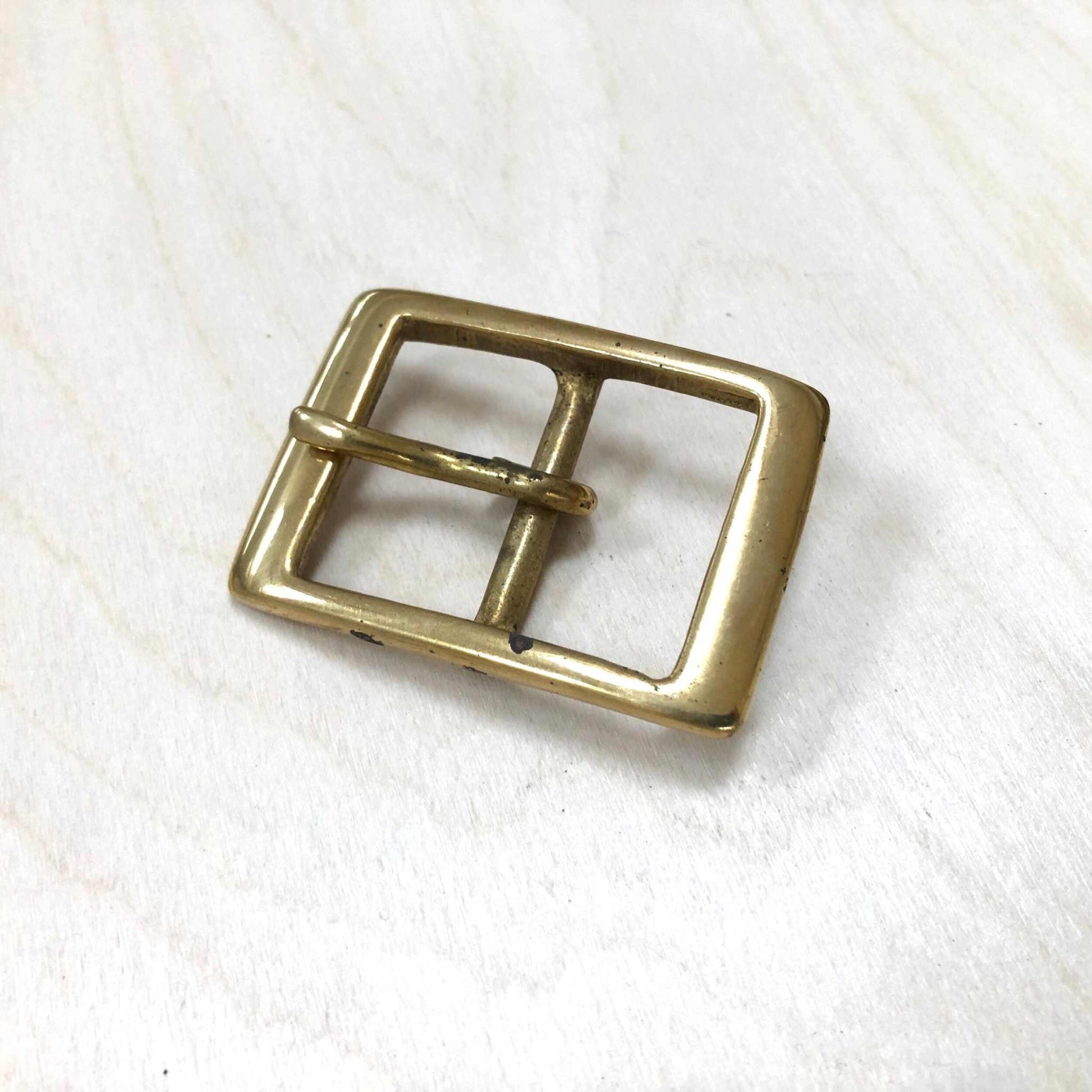 Solid brass belt buckle double frame with pin, square design.