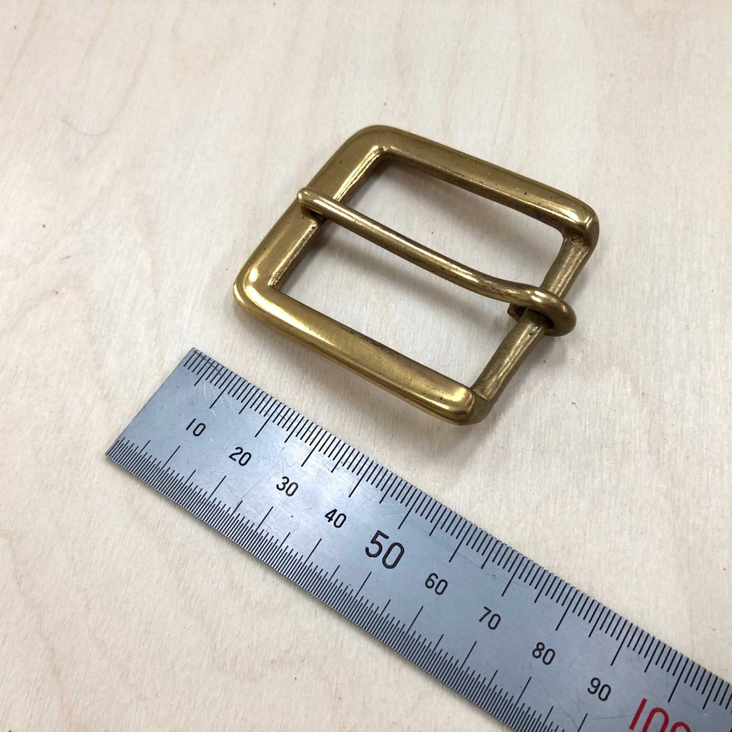 Solid brass belt buckle with square frame and pin, 38mm width, 54mm length.