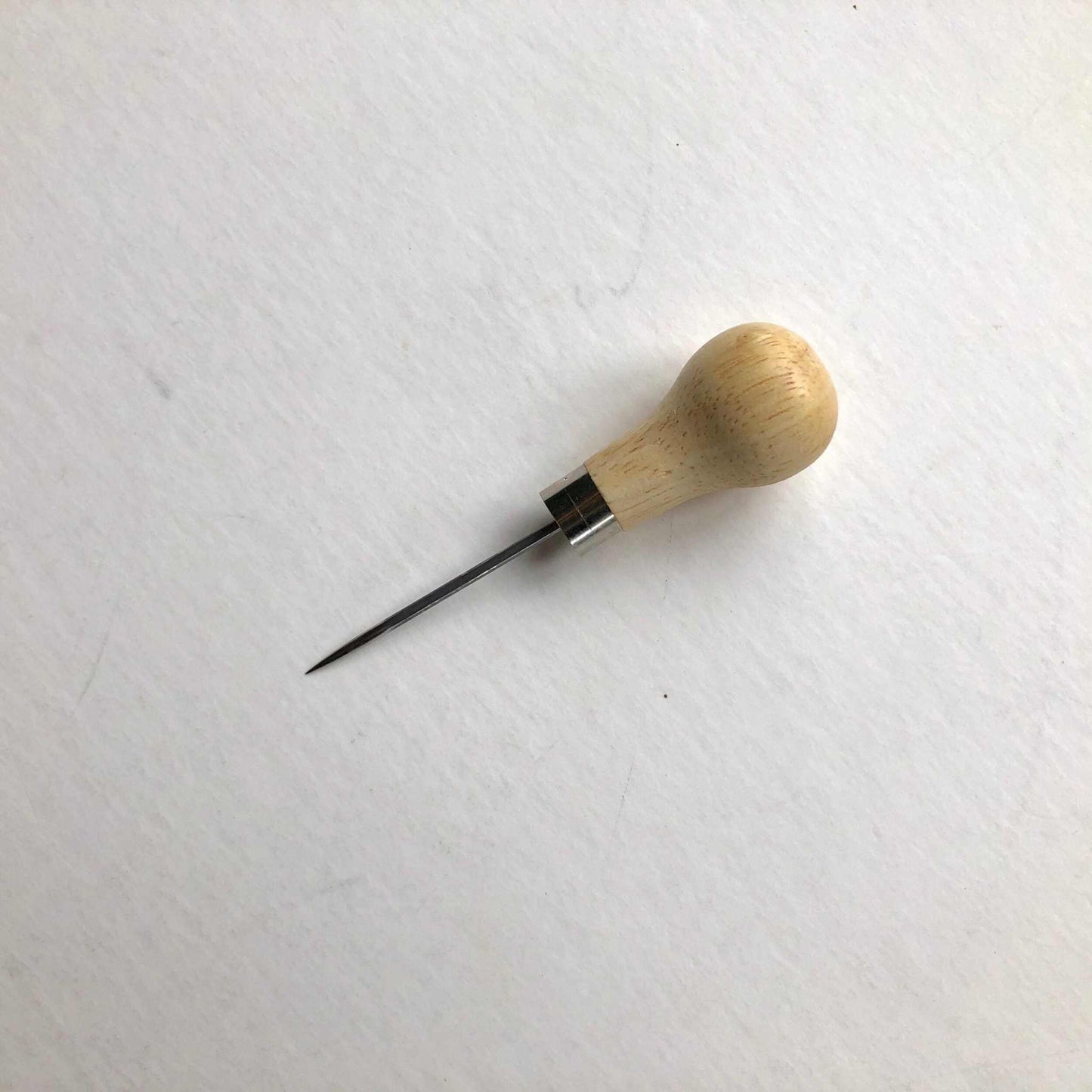 Wooden handled scratch awl with stainless steel blade for leathercraft.