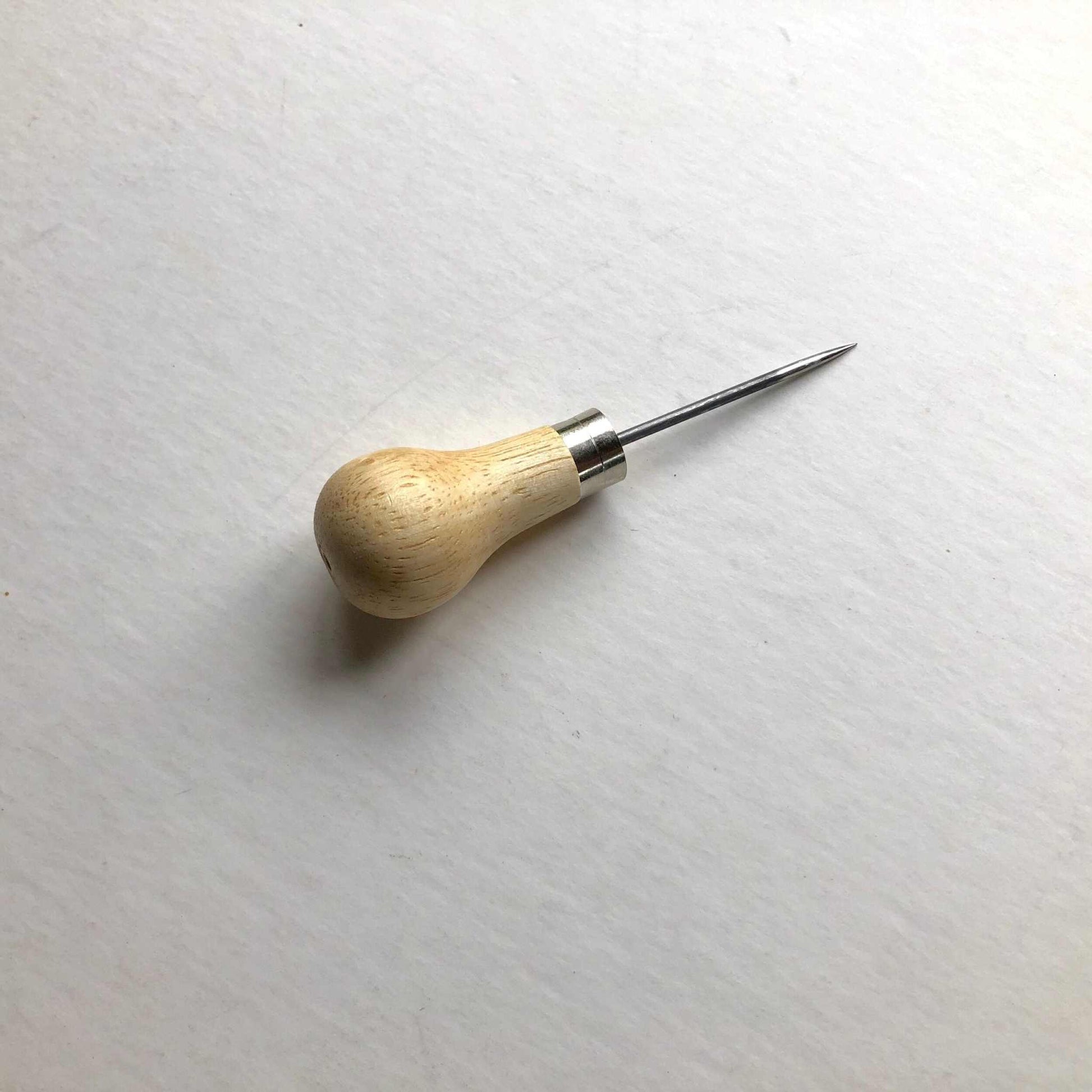 Wooden Handled Scratch Awl with stainless steel blade and contoured handle for leathercraft precision.